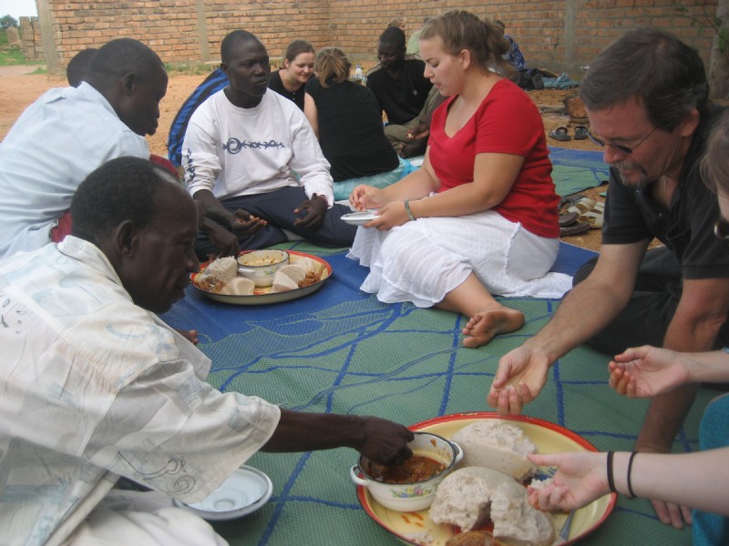 Sharing a meal of boule and goat sauce on the Bible institute campus in Moundou, Chad, in 2009.