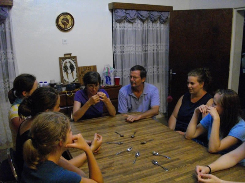 Team from Northwest Univ, playing a wicked game of "Spoons" in our home in Moundou, Chad in 2009.