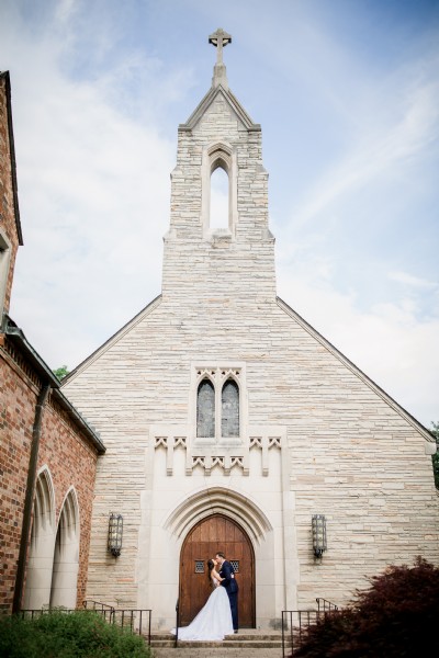 Beautiful wedding photo in front of the church doors with the steeple at Graystone Presbyterian Church in Knoxville Tennessee