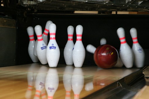 Bowling pins and  ball