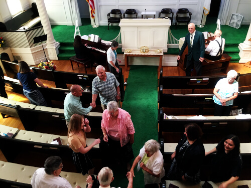 Church Members Greeting One Another