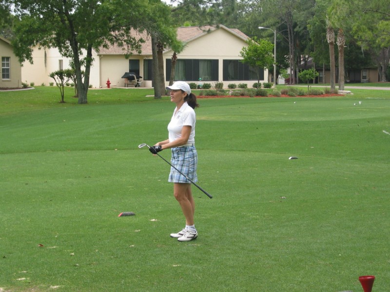 female golfer on tee box