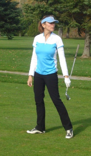 female golfer looking back