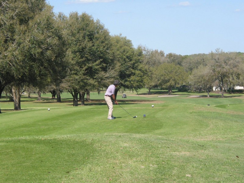 male golfer teeing off