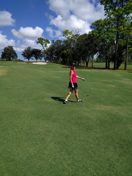 golfer walking on the course