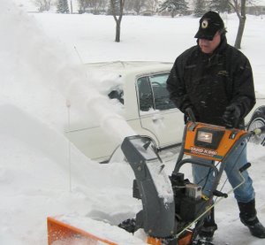 Larry putting the snowblower to work