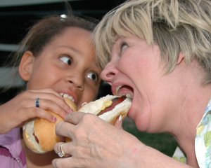 Myanna and Gloria eating hotdogs