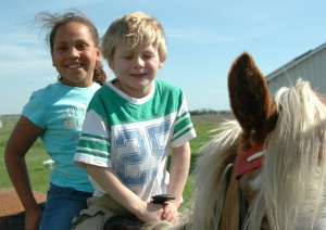 Myanna and Zach enjoying the horses!